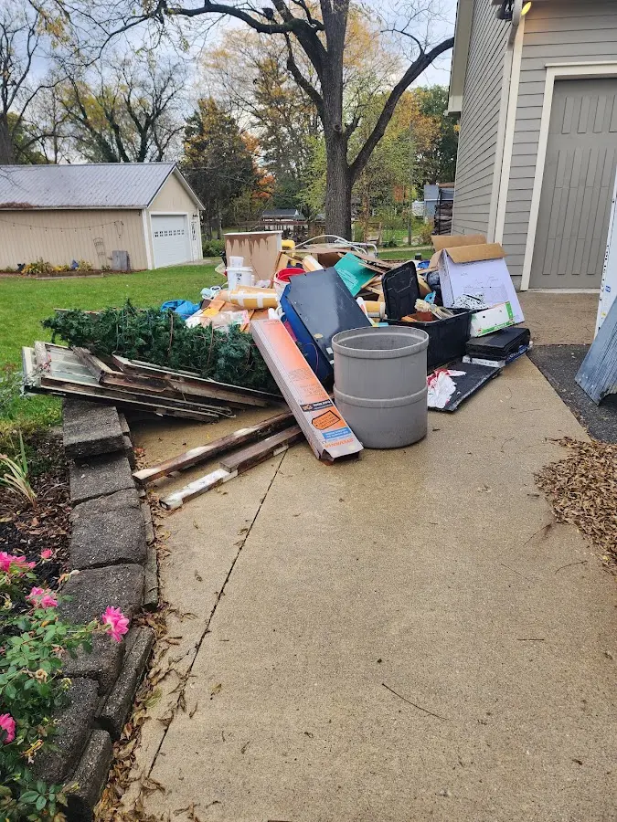 Dumpster being loaded with debris for 3 Yard Dumpster Rental in Grangeville